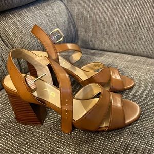 Never worn heeled sandals. Brown.